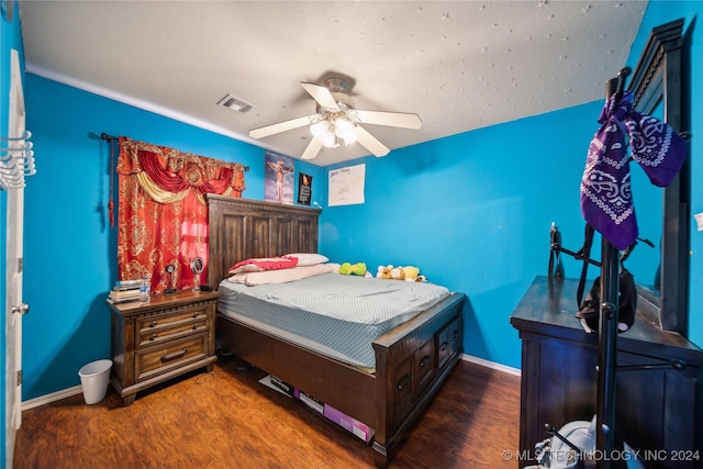 bedroom featuring ceiling fan and dark wood-type flooring