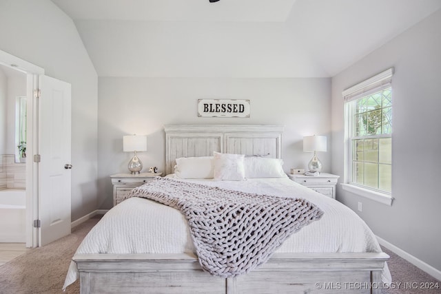 carpeted bedroom featuring lofted ceiling