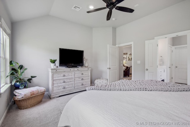 bedroom featuring carpet, connected bathroom, ceiling fan, and lofted ceiling