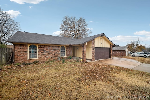 ranch-style home featuring a garage