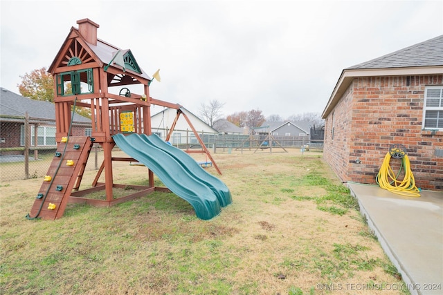 view of jungle gym with a lawn