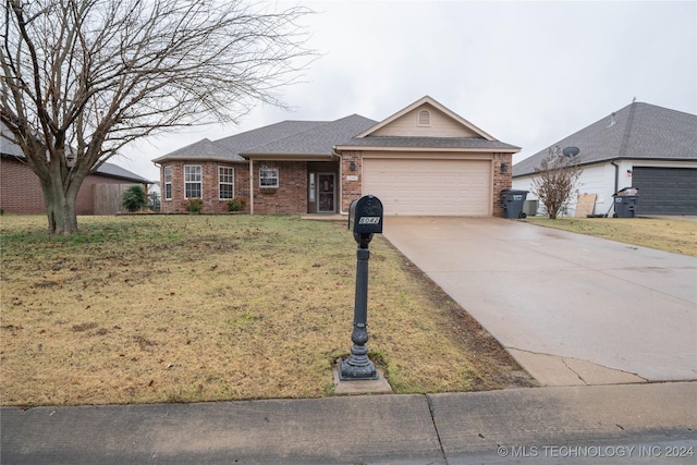 ranch-style house with a garage and a front yard