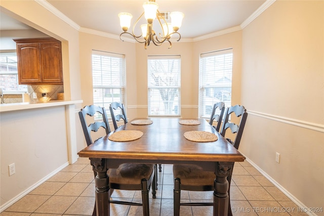 dining area featuring light tile patterned floors, crown molding, and a chandelier