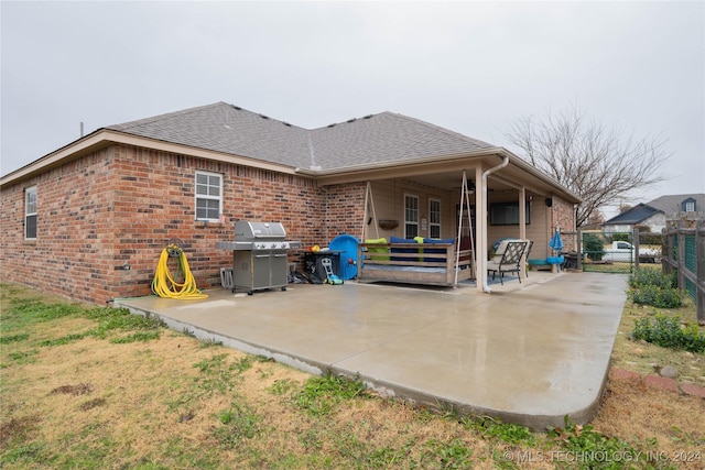 back of property with a patio