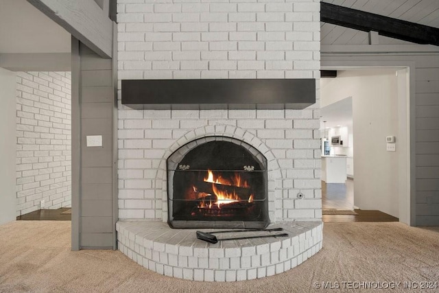 details featuring carpet floors and a brick fireplace