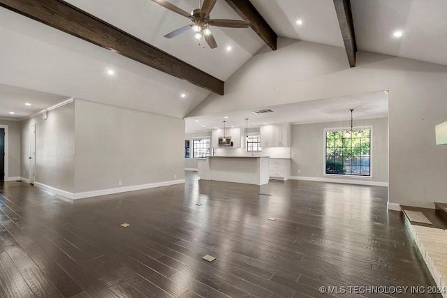 unfurnished living room with high vaulted ceiling, ceiling fan with notable chandelier, baseboards, beam ceiling, and dark wood-style floors