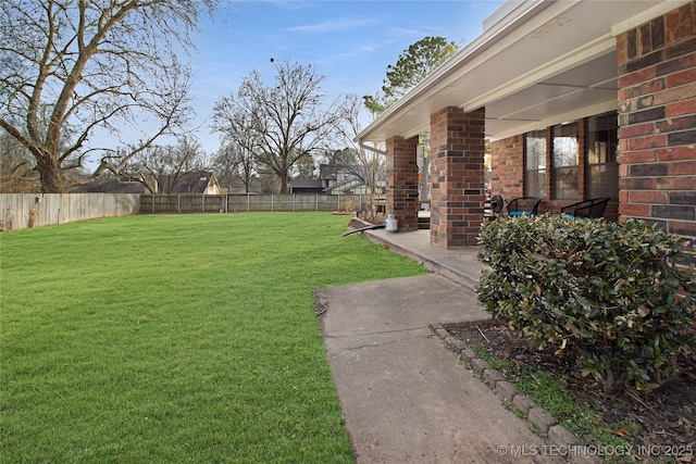 view of yard with a fenced backyard