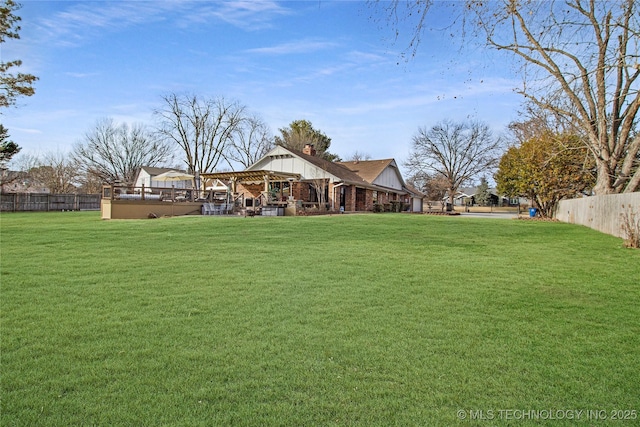 view of yard featuring fence and a gazebo