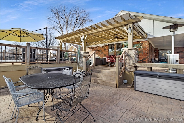 view of patio with a bar and outdoor dining area