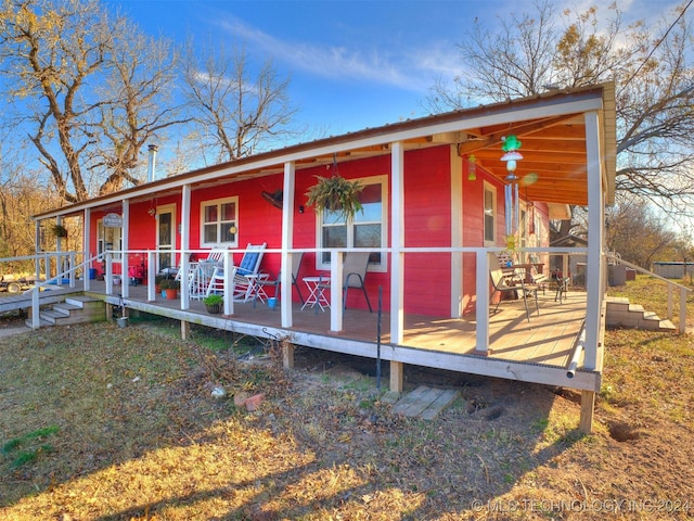 rear view of property featuring a porch