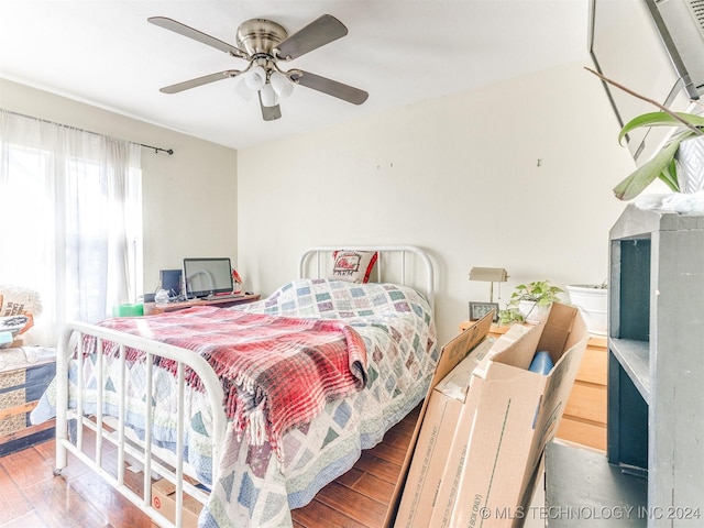 bedroom featuring ceiling fan and wood finished floors