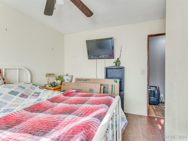 bedroom with ceiling fan and wood finished floors