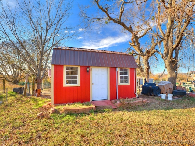 view of shed with fence