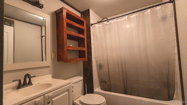 full bathroom featuring a textured ceiling, vanity, toilet, and shower / bathtub combination with curtain