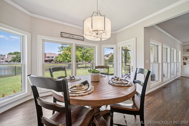 dining space with ornamental molding, dark hardwood / wood-style floors, and a chandelier