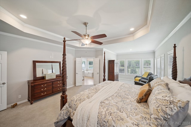 carpeted bedroom featuring crown molding, ceiling fan, and a tray ceiling