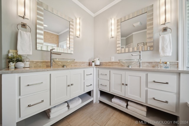 bathroom with crown molding and vanity