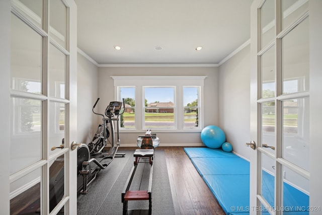 exercise room with french doors, dark hardwood / wood-style floors, and crown molding