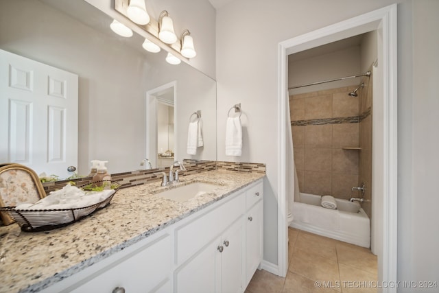 bathroom featuring tile patterned flooring, vanity, backsplash, and shower / bath combination with curtain