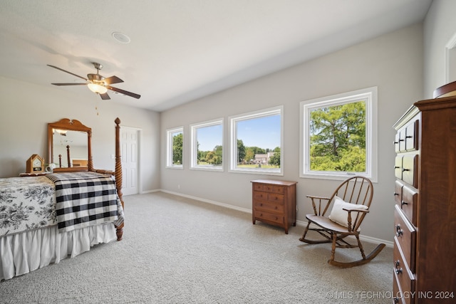 bedroom with ceiling fan and light colored carpet