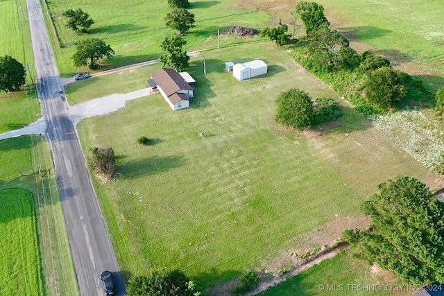 birds eye view of property featuring a rural view