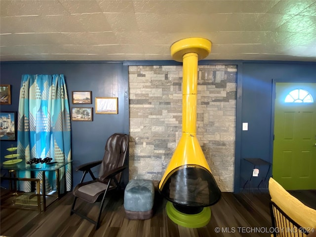 sitting room with dark hardwood / wood-style flooring