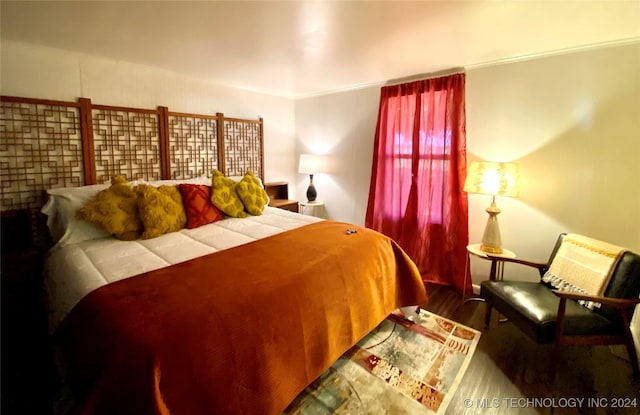 bedroom with wood-type flooring