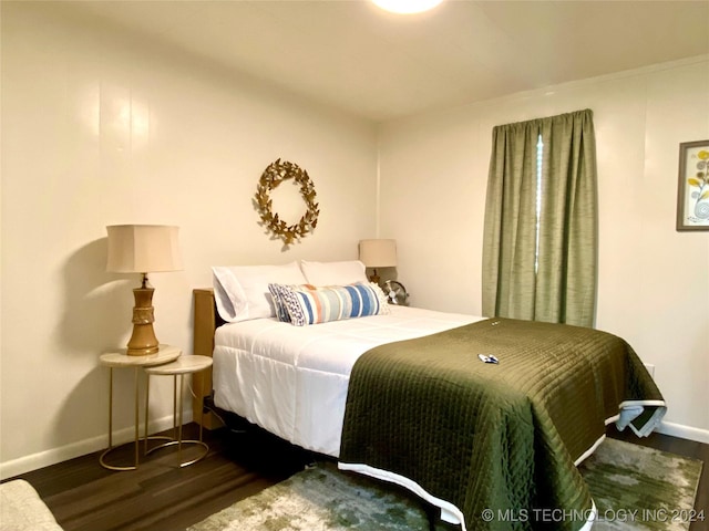 bedroom featuring dark wood-type flooring