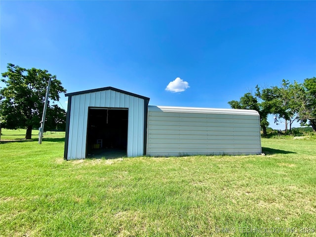 view of outdoor structure with a lawn