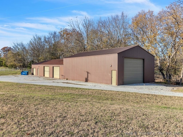 garage featuring a lawn