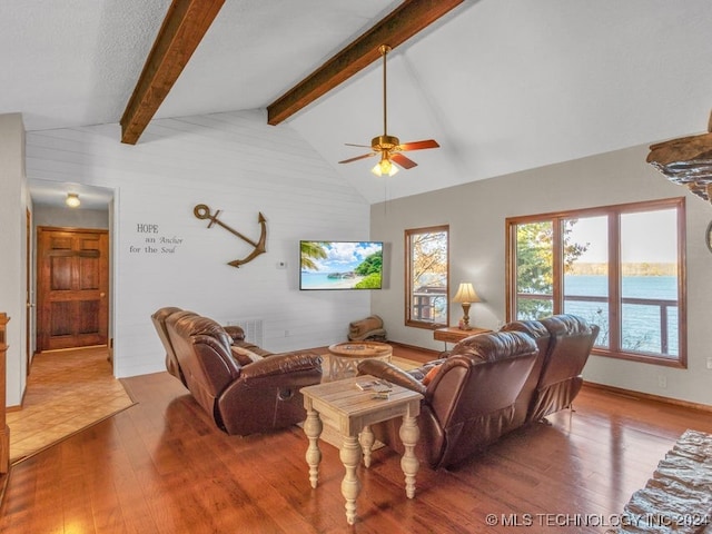 living room with vaulted ceiling with beams, ceiling fan, and wood-type flooring