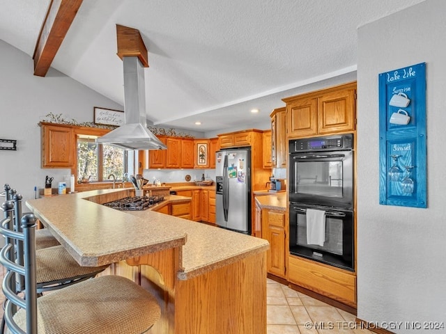 kitchen with lofted ceiling with beams, a breakfast bar area, island range hood, light tile patterned flooring, and appliances with stainless steel finishes