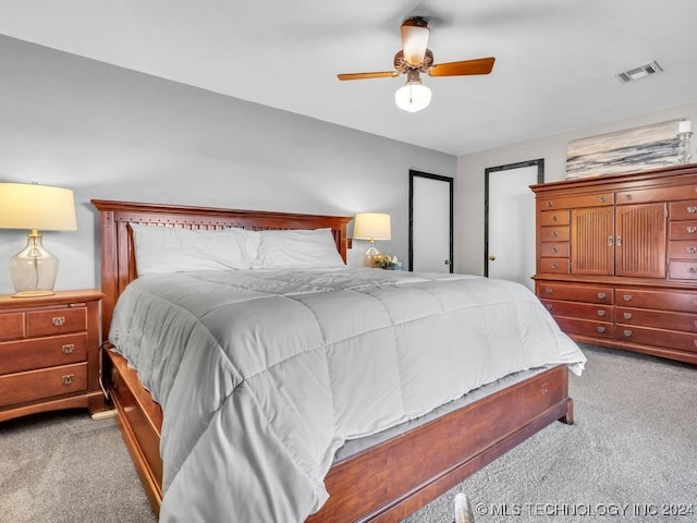 carpeted bedroom featuring ceiling fan