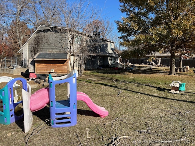 view of jungle gym featuring a yard