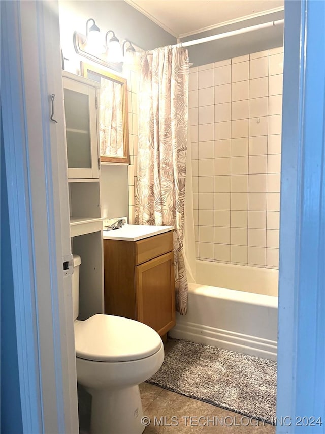 full bathroom with tile patterned floors, vanity, toilet, and shower / bath combo with shower curtain