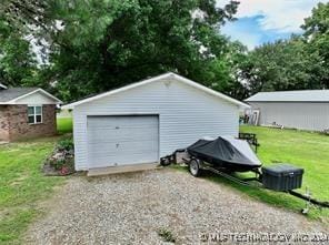 garage with a yard