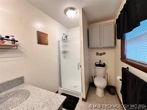 bathroom with toilet, tile patterned flooring, and walk in shower