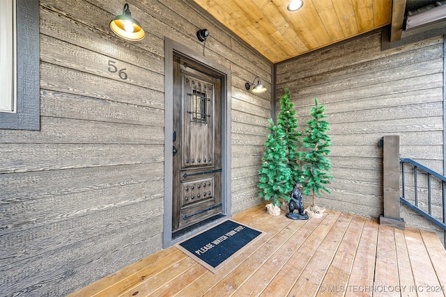 doorway to property featuring covered porch