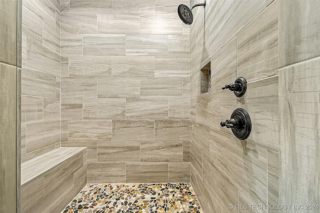 bathroom featuring tiled shower