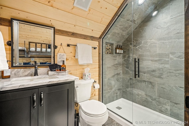 bathroom with vanity, lofted ceiling, wooden walls, toilet, and a shower with shower door