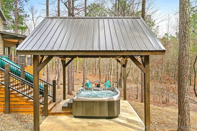 view of patio featuring central AC and a hot tub