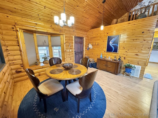 dining area with hardwood / wood-style floors, wooden ceiling, high vaulted ceiling, and a chandelier