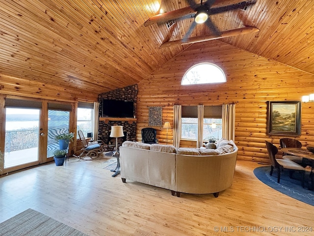 living room with light wood-type flooring, high vaulted ceiling, a healthy amount of sunlight, and wood ceiling