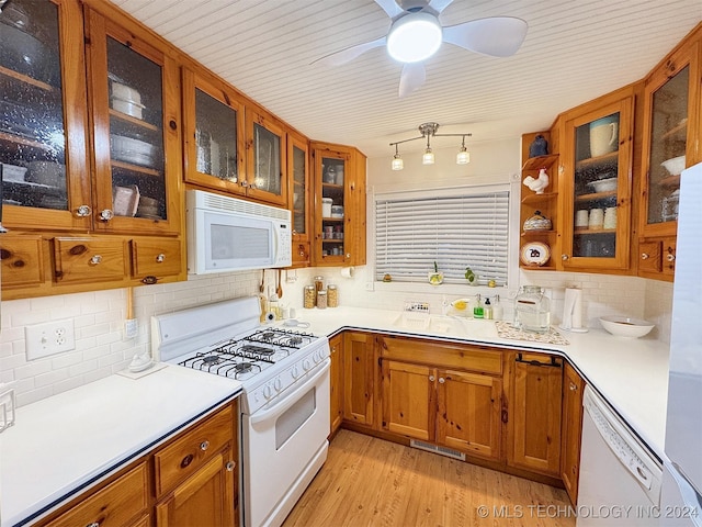 kitchen featuring ceiling fan, tasteful backsplash, white appliances, and light hardwood / wood-style flooring