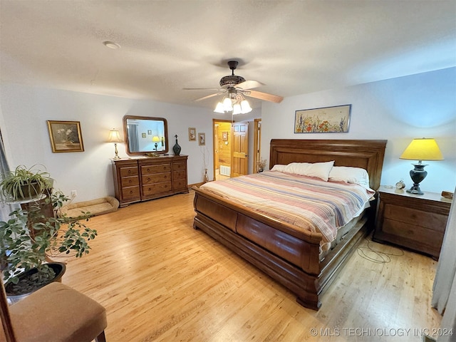 bedroom with light wood-type flooring and ceiling fan