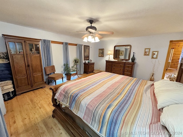 bedroom featuring ceiling fan and light wood-type flooring