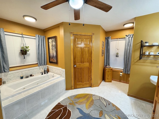 bathroom featuring a relaxing tiled tub, tile patterned floors, and ceiling fan