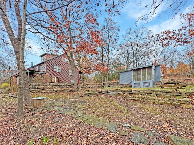 view of yard with a sunroom