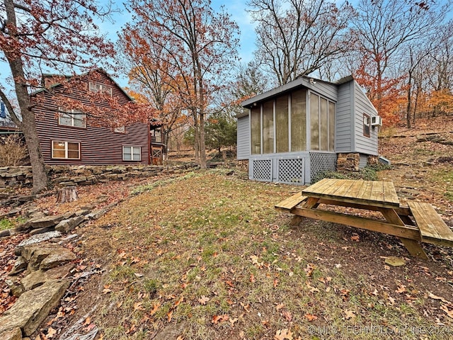 view of yard with a sunroom