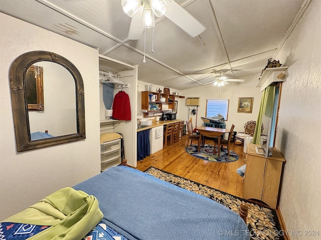 interior space featuring hardwood / wood-style floors and lofted ceiling